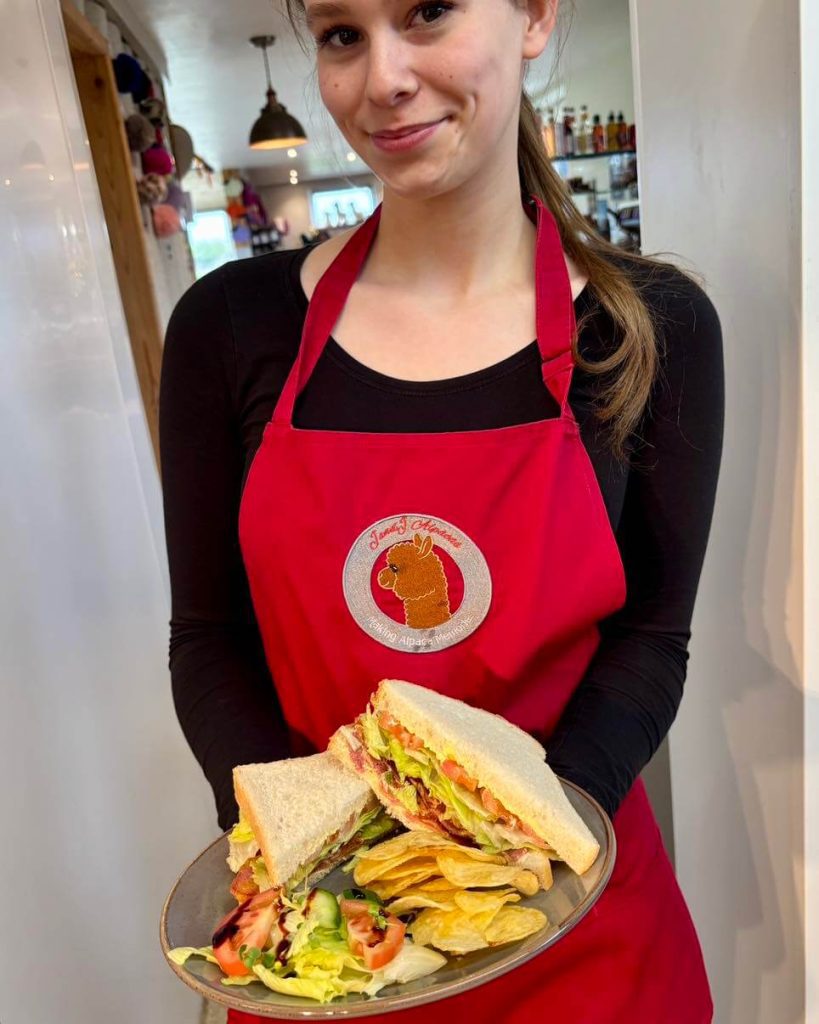 coffee shop 2 Server holding plate of food at j and j coffee shop